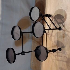 Adjustable black metal candle holder